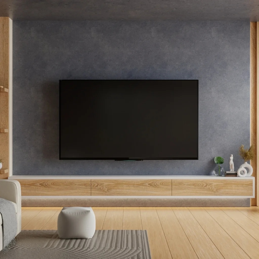 Flat-screen TV mounting bracket being secured to an interior wall